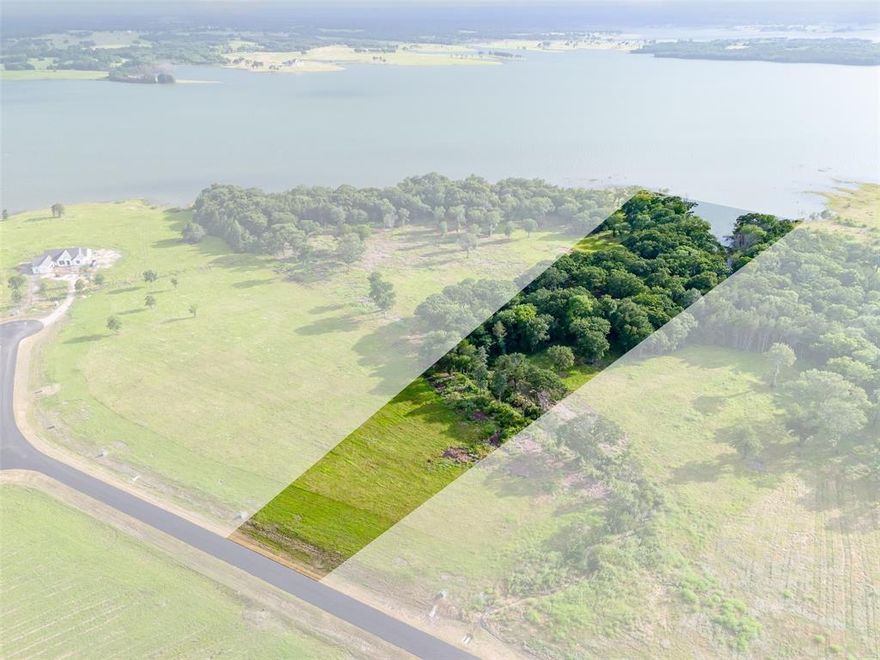 LAKEFRONT PARADISE ON BOIS D’ARC LAKE! This exceptional 3-acre lakefront lot offers several hundred feet of shoreline on the main body of deep water at beautiful Bois D’Arc Lake in Honey Grove, TX — and you can bring your own builder to create the lake retreat of your dreams! This lot has plenty of room to build your custom home with 100' across at the street, add a pool near the home, or zip lines through the trees and fire pit with covered patio to enjoy the sunset views and listen to the water. Set within a gated section of the community, this rare property features dock-capable, (pending NTMWD approval), mature trees, a spacious grassy area, and expansive water views that offer a perfect blend of natural beauty and peace. With personal docks allowed, you’ll enjoy direct access to all the lake has to offer — fishing, boating, relaxing, and breathtaking sunsets. As part of a thoughtfully planned luxury lakefront development, you’ll also enjoy exclusive amenities including a clubhouse with lakefront pool, putt-putt course, fitness center, and grilling area for entertaining. Coming soon: dog park, pickleball courts, playground, multi-sport field, community marinas. Plus, you’re just minutes from Bonham for shopping and everyday conveniences. Don’t miss this unique opportunity to build your dream home on one of the most desirable lots on Bois D’Arc Lake!