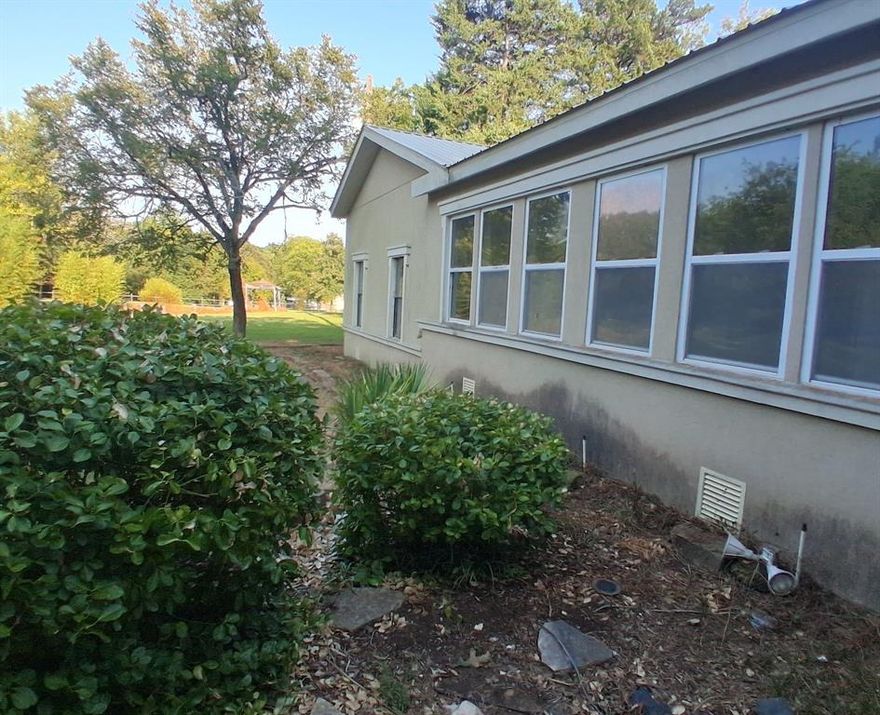 MAJOR PRICE IMPROVEMENT! COME CHECK IT OUT. Beautiful countryside view on almost 3 acres! Country living at its best with stocked pond, chicken pen with hatchery, 2workshops, 2 car detached garage with a separate office is perfect for remote workers. 3rd bedroom can easily be converted to a small office. Outside staircase leads to an unfinished bonus room. Property has a water well and lots of trees. Conveniently located at the edge of Quinlan TX and only a short drive to Kaufman, Greenville or Rockwall. Come take a look before this property is gone! Sold AS-IS.