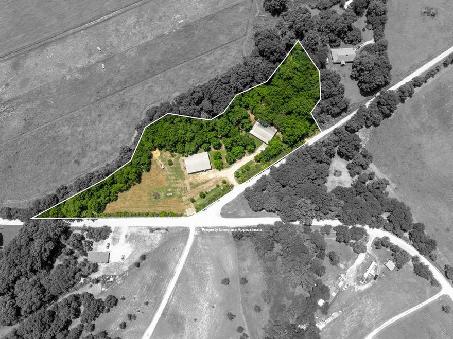 Country Living with Room to Roam – Plus a Massive Shop, Guest Quarters, and peaceful porch views worth every penny!
This property has it all! Be sure to ask your REALTOR® for the full list of features. Nestled on nearly 4 acres, this property is dotted with a variety of fruit trees, mature pecan and elm trees, and bursts into color each spring with blooming bluebonnets. A tranquil creek borders two sides of the land, adding to the serene atmosphere. Inside the main home, you'll find an abundance of storage including multiple closets, a custom built-in pantry, a cedar closet, and generous walk-in closets. A versatile spare bedroom with a bay window and gas fireplace can serve as a cozy den, office, or guest space. The inviting wraparound porch offers shaded space to relax with your morning coffee or enjoy a summer thunderstorm. The owners have made several recent investments totaling more than $60,000 in cost—new concrete porch surrounding the home on 3 sides, a retaining wall with piers every 10 feet, fresh sod, trimmed trees, reset septic tank—all aimed at enhancing the home’s beauty and providing long-term value. The impressive 2,400 sq ft shop includes a 1-bedroom, 1-bath living space (approx. 500 sq ft) with covered parking. Perfect for extended family, guests, or rental income, this additional unit has been freshly painted, includes all appliances, and is truly move-in ready. An optional 1.92-acre parcel across the road is also available for purchase. While the sellers intend to sell it separately, they are open to negotiating a discounted price for the homebuyer.
With so much to see and explore, be sure to allow plenty of time for your showing—this unique property is full of features you’ll want to take in firsthand!