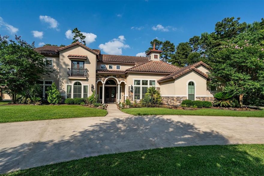 Imagine pulling up to a Spanish Mediterranean architectural design residence nestled within the prestigious Benders Landing Estates in Spring, Texas. This property is a statement of refined living, where luxury blends with tranquility on the lake: 4 bed, 4.5 bath, 2 living rooms, 2 dining rooms, theater, wet bar with wine cellar, custom beach entrance pool, jacuzzi with grotto waterfall. Professional landscaping featuring mature trees and manicured gardens guides you along the circular driveway to a porte cochère or to an attached 3 car garage. Stepping through the impressive entryway, you're greeted by soaring ceilings, fireplace, an abundance of natural light, beautiful pool and lake views. The heart of the home is the gourmet kitchen with SS appliances, custom cabinetry extending to the ceiling, exquisite countertops, spacious pantry and a nearby breakfast nook offers a sun-drenched spot to start the day. The 4 generously sized bedrooms offer private sanctuaries. The primary suite is a true retreat, boasting panoramic lake views, a spa-like ensuite bathroom with a soaking tub, a separate tiled shower with multiple showerheads, dual vanities and expansive walk-in closets. The additional 3 bedrooms are equally well-appointed providing comfort and privacy. Multiple living spaces cater to both formal entertaining and casual relaxation. However, the true allure of this property extends beyond the interior. Step outside to your own private oasis. An outdoor kitchen complete with built-in grill sets the stage for al fresco dining. Enjoy the tranquility of the water, whether it's fishing, kayaking, or simply appreciating natural. Living in Benders Landing Estates adds another layer of exclusivity: this sought-after community is known for its large, estate-sized lots, mature trees, and sense of privacy. It's more than just a home; it's a legacy property.