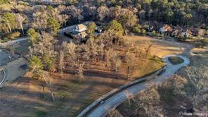 1.801 acre lot for sale in exclusive Esplanade Subdivision.  Located on quiet cul-de-sac with extremely low traffic.  High topography offers a substantial amount of privacy.  Close to south gate which allows easy access to Ellerbe Road. 
*****SELLER IS WILLING TO SUBDIVIDE 1.801 ACRE LOT TO ACCOMODATE BUYER, BETWEEN .8 ACRES AND 1 ACRE.*****