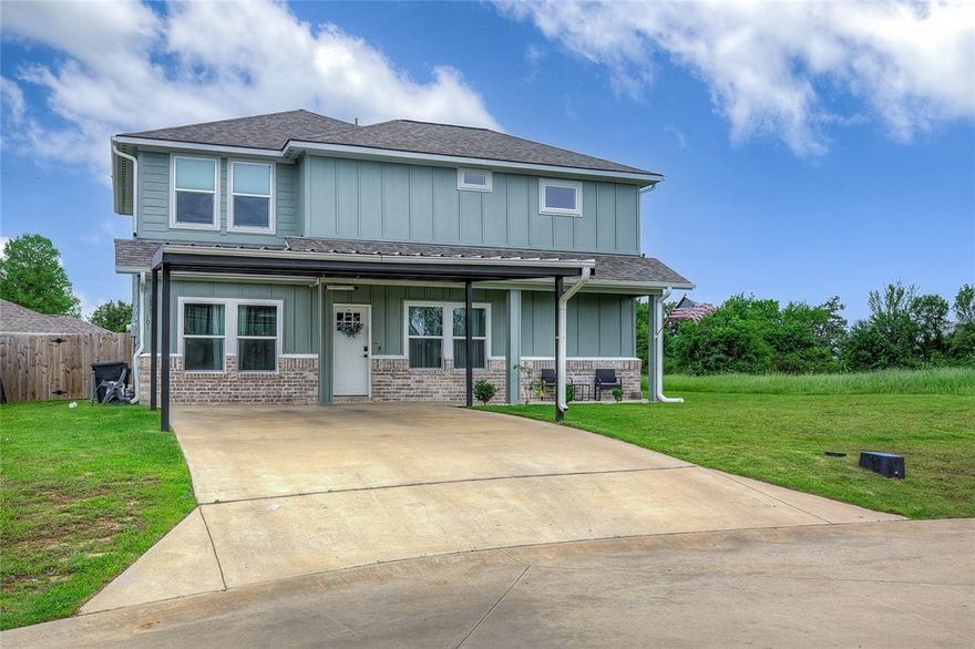 Welcome to your dream family home, perfectly tucked away at the end of a quiet cul-de-sac where peace of mind and minimal traffic are part of the charm. This stunning two-story residence offers a thoughtful layout designed for modern living, featuring an open-concept main floor with durable luxury vinyl plank flooring. The heart of the home is the bright kitchen, boasting crisp white cabinetry, elegant granite countertops, and a functional island that overlooks the living area and its cozy electric fireplace. For those who love to gather, the original one-car garage has been professionally converted into a spacious formal dining room, creating the perfect backdrop for holiday meals and celebrations.The primary suite serves as a true private retreat on the main level, complete with two walk-in closets and a spa-like en suite bathroom featuring a soaking tub, a separate shower, and double sinks. Upstairs is a dedicated kids' zone or guest wing, featuring three additional bedrooms, a full bathroom, and a second living area that the current owners have loved for keeping play and relaxation separate from the main floor.Step outside to find a secure, privacy wood-fenced yard and a versatile exterior building equipped with electricity—currently utilized as a home gym and workshop. The property also includes an attached two-car carport for convenient covered parking.Location is everything! This home is ideally situated near the new elementary school currently under construction, making morning drop-offs a breeze. For the commuter, you are in close proximity to Interstate 30, providing quick and easy access for work or weekend travel.Buy with total confidence knowing this home comes with incredible peace of mind: there are 7 years remaining on the builder’s 10-year limited warranty, which is fully transferable to the new owners. This home truly offers the best of both worlds: a spacious, updated interior and a safe, neighborhood feel where kids can play freely.