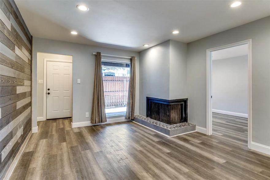 Discover modern comfort and effortless living at 7152 Fair Oaks Ave #1039 in Dallas, TX 75231. This stylish 1-bed, 1-bath first-floor condo is designed for first-time buyers, students, or anyone seeking a simplified lifestyle. Stackable washer and dryer stay along with new refrigerator.  Enjoy a sleek interior featuring plank flooring, a bold feature wall, smart Topgreener dimmer switches, and a cozy wood-burning fireplace. The updated kitchen includes a black stainless-steel glass-top stove, built-in microwave, dishwasher, and washer-dryer hookups. A bathroom barn door opens to a spa-inspired space with a rain faucet, self-cleaning toilet, and fresh finishes. The spacious walk-in closet, newer electric panel, and fresh paint throughout add value and peace of mind. French doors lead to your private patio, tucked deep within the complex for extra privacy. With no new assessments, new mailboxes, and quick access to Greenville Ave, US-75, universities, Northpark Centre, and more—this is city living made easy.  *OWNER, FINANCING*