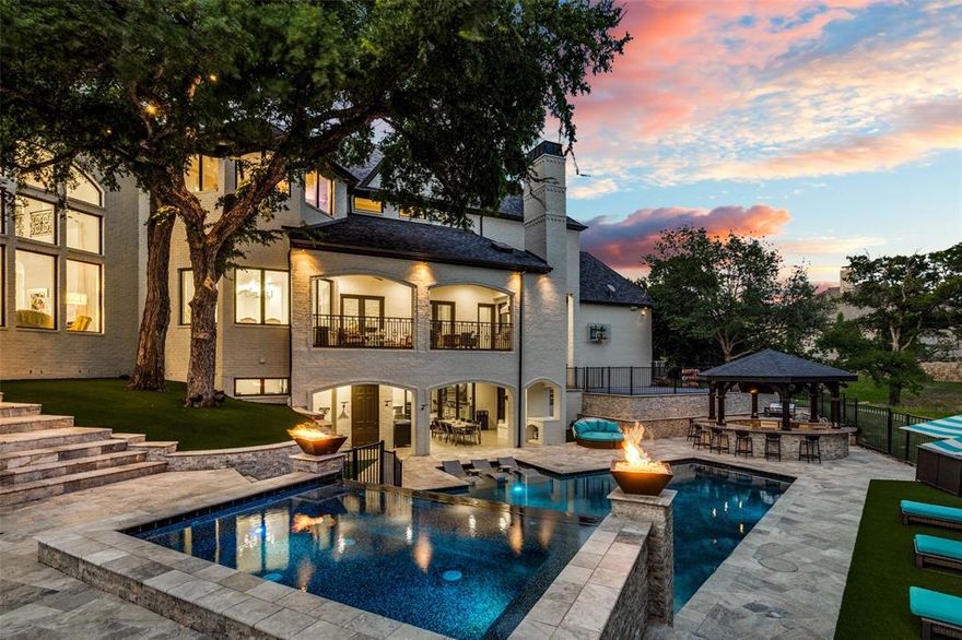 Resort style living in this extraordinary custom home located in the prestigious Starwood Community. Prepare to be indulged w an abundance of lavish amenities from the walk out basement, pool & spa to the two story terrace w a balcony offering stunning views of the approx. half-acre heavily treed backyard. Enjoy state of the art home theater, fitness studio, & game rm. The wine cellar & caterer's bar cater to your entertaining needs, while the sauna & sport court add an extra touch of luxury. The expansive outdoor kitchen, terraces, & greenspace create the perfect setting for outdoor gatherings. The design details of this home are truly exquisite, featuring soaring ceilings adorned w wood beams, marble & hardwood flooring, cozy fireplaces, & sophisticated finishes throughout The gourmet kitchen is a chef's dream, boasting marble counters, double islands, & custom cabinetry. Retreat to the primary suite & discover a two-story walk in closet & a spa like bath w marble finishes.