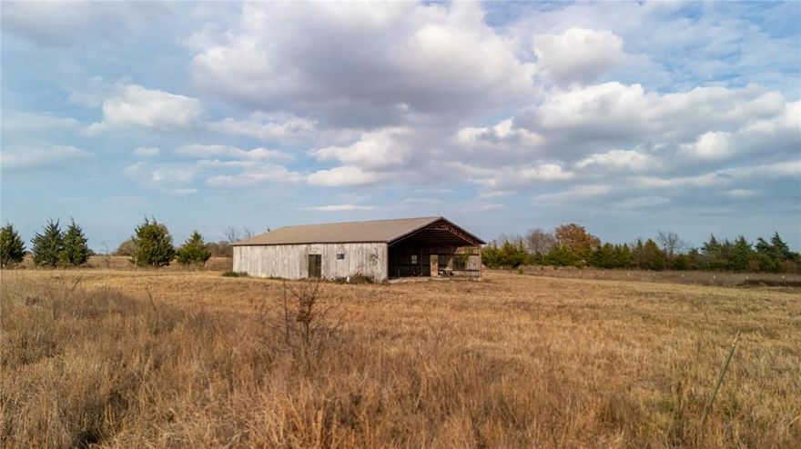 Discover 39.379?acres in rural Clarksville, TX! An expansive parcel offering barndominium-ready potential, with a 2,800?sq?ft framed structure, full rough-in plumbing, two temporary electrical panels, and water service on-site. Sited on County?Rd?3255 and just 10?minutes from the Red River, this unrestricted acreage presents ideal space for a residence, ranch, weekend getaway, or investment. Open pasture and gentle terrain provide excellent grazing and build possibilities. The structure’s metal roof and open-frame layout await your finishing touches. Tree lines and a pond enhance the scenery. Outdoor enthusiasts will appreciate the location: 5?miles north lies Lennox Woods Nature Preserve with hiking and nature access; public recreation lakes Raymond?Gary, Hugo and Bob?Sandlin are nearby for fishing, boating and camping. About 30?minutes to Paris, TX, this property blends convenient access and acreage. No HOA and impressive flexibility: ideal for barndominium conversion, livestock, storage-barn use, or full residential construction. If you’re searching for “acreage with barn,” “country living near river,” “barndominium ready home site,” or “large lot Clarksville TX,” this offering delivers. Schedule your visit and explore how this site can evolve into your next rural lifestyle.