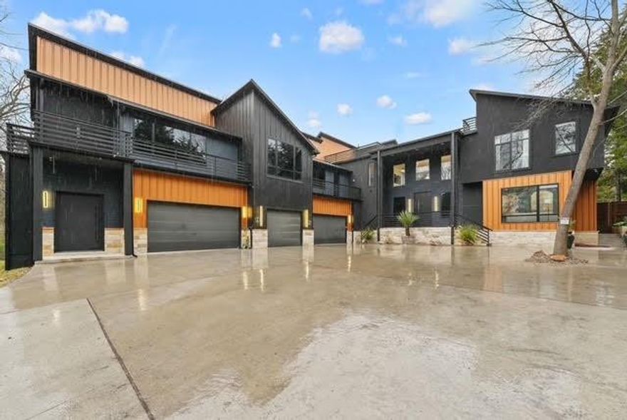 FEEL LIKE YOU'RE ON VACATION...IN YOUR OWN HOUSE!!  This SECLUDED OASIS ON 2 ACRES is tucked away ONLY 17 MINUTES to DOWNTOWN DALLAS!!  Luxury redefined in this WIDE OPEN 7,300 sq ft, 7 oversized bedrooms, 7 full baths, 7 car garage, 2nd Primary wing, 2 offices, 2 utility rooms, 2 islands in the kitchen, a balcony plus a separate rooftop area taking entertaining to unprecedented levels. OF COURSE there's a pool with a spa.  OF COURSE the Primary Bedroom, bathroom and closets are so expansive they need their own zip codes.  OF COURSE 5 bedrooms have their own ensuite bathrooms.  OF COURSE the garage has ROOM FOR ALL YOUR TOYS PLUS ROOM FOR A GYM.  OF COURSE there's an electric gate protecting this one-of-a-kind CUSTOM CREATED CASTLE.  Fully FOAM INSULATED ROOF AND WALLS. 10,200 sq ft including porches, balcony and roof top deck!  BUT WAIT, THERE'S MORE- Includes a guesthouse ready to be finished out to your desire!!  5 mins to I-35E and I-20, 29 mins to AT&T Stadium & Globe Life Field, 26 mins to Love Field, 37 mins to DFW Airport.  THE PRICE IS NO TYPO. **511 S Bluegrove next-door can be purchased as well.**