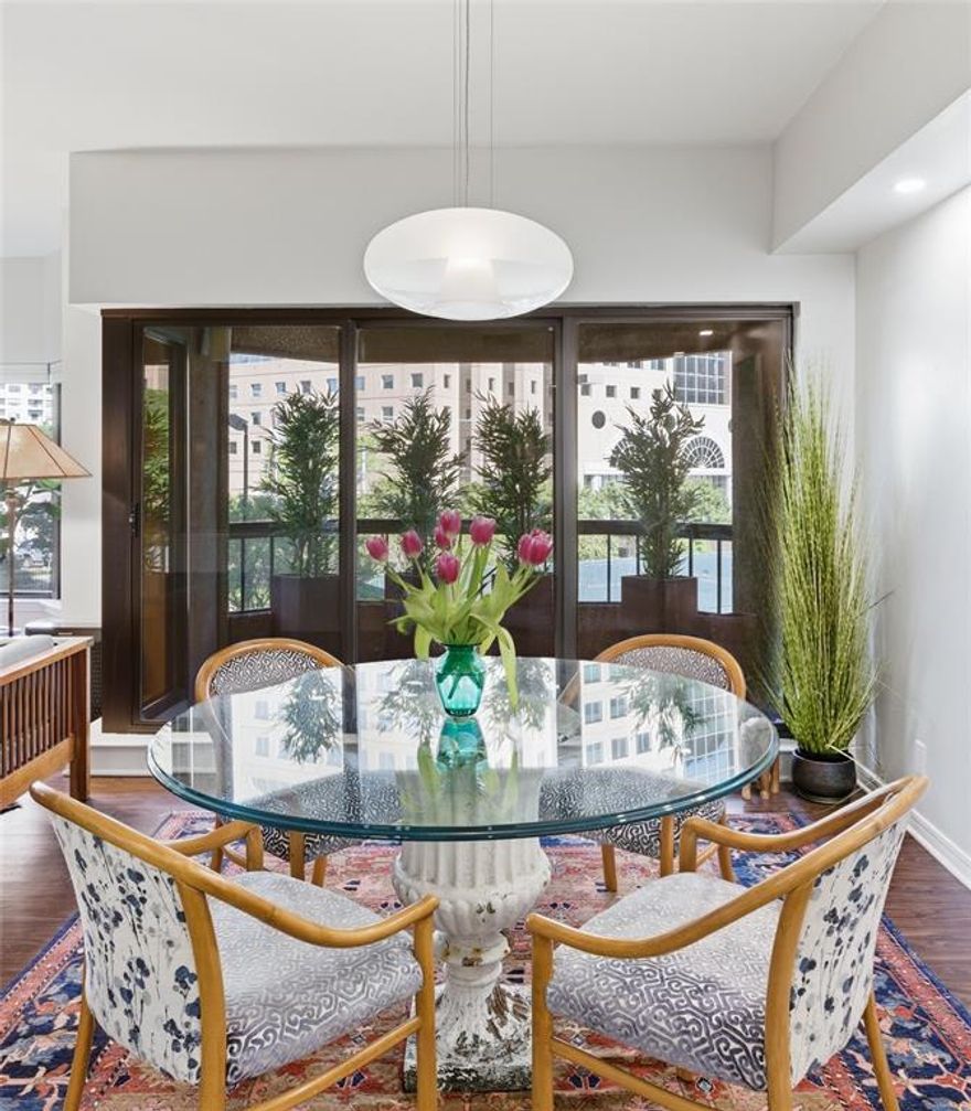 This beautifully updated 2-bedroom, 2-bath residence at La Tour Condominiums offers a rare balance of urban energy and park-like serenity. Surrounded by lush treetop views, the home is filled with natural light from expansive bay windows, creating a calm, elevated atmosphere in the heart of the city.
A proper foyer sets the tone—an increasingly rare feature that creates a true sense of arrival and separation from the main living spaces. Beyond, the open living and dining areas unfold with ease, flowing naturally to a private terrace ideal for morning coffee or evening relaxation. The layout lives like a home, with a distinct bedroom wing that offers privacy and comfort for both residents and guests.
Thoughtfully renovated, the residence reflects quality and refinement throughout. Wide-plank flooring, solid-core doors with Emtek hardware, and a curated mix of Miele and Bosch appliances bring together form and function. Bathrooms are finished with sleek quartz and marble countertops and warm, quarter-sawn wood vanities, creating a clean, modern aesthetic with timeless appeal.
Life at La Tour is defined by service, amenities, and a strong sense of community. Residents enjoy 24-hour concierge, a resort-style pool and spa, saunas, a sunny fitness center, tennis and sport court, firepit, dog park, and an inviting club room for gatherings and events. Dedicated EV charging station at your assigned parking spaces!
Step outside and experience one of Dallas’ most walkable neighborhoods, with a walk score of 98 along McKinney Avenue. Dining, coffee, and everyday conveniences—including Whole Foods Market—are just blocks away, while the nearby Katy Trail offers miles of scenic paths for walking, running, and biking.
This is a rare opportunity to enjoy the vibrancy of Uptown without sacrificing privacy—an elegant, lock-and-leave residence that truly lives like a home.