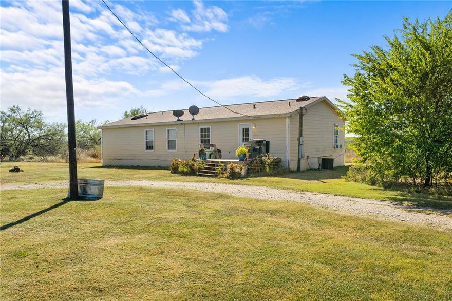 If peace and quiet under the Texas sky is what you are looking for, you have found it! This is an amazing price on a double wide manufactured home nestled on 5 acres in Barry! This home is incredibly spacious at 1920 square feet and features an ideal split bedroom floor plan. The kitchen is the heart of the home with a walk in pantry, large island, and an abundance of counter and cabinet space. The primary bedroom is right off the cozy living room and features a bathroom almost as big as the bedroom! You have a dual sink vanity, garden tub, separate shower and a huge walk in closet. With no known restrictions, the possibilities here are endless so come on out and take a look while you still can. BACK ON MARKET DUE TO PREVIOUS BUYERS LOSING FINANCING.