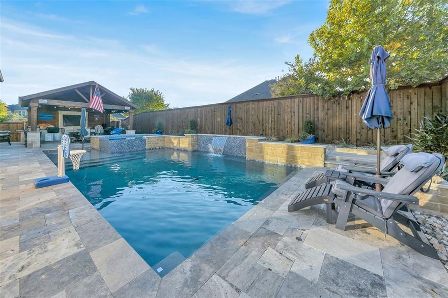 This beautifully designed home offers 4 spacious bedrooms, 3 full baths, and 2 half baths, all wrapped in great curb appeal with a brick exterior, lush landscaping, and a three-car tandem garage. Inside, the open-concept layout blends style and warmth. The gourmet kitchen features custom cabinetry, a large island, premium stainless steel appliances including a gas cooktop, and a butler’s pantry with a built-in wine fridge. It opens to a bright living room anchored by a dramatic floor-to-ceiling stone fireplace. The main level includes a private study, media room, comfortable guest suite, and a relaxing primary suite with a garden tub, walk-in shower, dual vanities, and a generous closet. Upstairs offers two bedrooms with a Jack-and-Jill bath plus a large game room. Step outside to a true backyard oasis featuring a custom pool and spa built by Jett Aquatics, complete with a sun deck and water features. The adjacent outdoor cabana includes abundant counter space, beverage fridge, griddle, storage drawers, trash pull-out, dedicated area for an egg grill, outlets, large TV mount, overhead fan, bistro lighting, and commercial-grade heaters—perfect for year-round enjoyment.  In addition, back yard features artificial turf, lush landscaping, hardscape, and a Tuff Shed and pool storage bins for storage. Residents enjoy Fairway Ranch’s resort-style amenities, including a community pool, playgrounds, ponds, the historic 19th Hole, and scenic trails. Located in Northwest ISD near Cox Elementary and premier Roanoke dining.