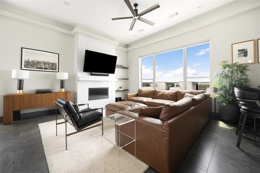 Luxury Corner Townhome with Rooftop Oasis + Smart Home Integration. Experience elevated living in this stunning 4 story Corner unit townhome featuring panoramic lake views + a fully integrated smart home experience. Built with contemporary elegance and top-tier materials, this newer construction boasts 5-inch wide plank real oak wood flooring throughout every level.With this Smart Home is complete control at your fingertips with whole-home audio, video, lighting, and blinds all operable via the RTI App. Speakers are integrated throughout every room, bathroom, and hallway. All lighting is on Lutron dimming switches, and every window is fitted with custom Hunter Douglas motorized shades. Step out to the Rooftop. 
Which is a true showstopper ...complete with custom flooring, a built-in Coyote grill, outdoor fridge and sink, and two zones of outdoor speakers with a subwoofer. Relax year-round with a full sauna and motorized UV shades enclosing all sides of the pergola.
An Entertainer’s Dream Living Room; the custom wet bar is the centerpiece of the living space, featuring a nugget ice maker, beverage fridge, dual-zone wine cooler, dishwasher, glass shelving, and a stunning glass tile backsplash. Step into the Chefs Kitchen with a professional Thermador appliance package, including a 48” 6 burner range with griddle, steam and convection ovens, warming drawer, and commercial-grade hood. The showstopping 5’x8’ dual waterfall quartz island includes hidden storage and is complemented by a food-grade butcher block prep island. All cabinetry throughout the kitchen and bathrooms is high end Milania soft-close.Relax in the Spa Inspired Bathrooms:Every bathroom features floating Milania vanities with vessel sinks. The primary suite showcases an oversized custom glass steam shower for the ultimate spa-like experience.
This home effortlessly blends luxury, technology, + lifestyle perfect for the discerning buyer seeking modern elegance and convenience in one exceptional package