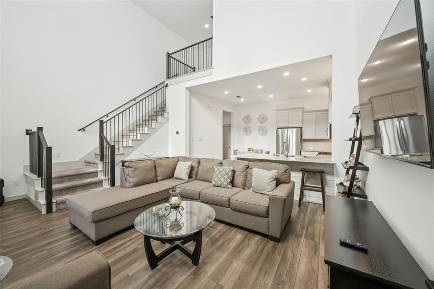 Like new and move-in ready! This stunning 2-bedroom, 2.5-bath North Richland Hills townhome blends modern design with everyday comfort. You’ll love the soaring ceilings, abundant natural light, and stylish designer touches that create a warm, welcoming atmosphere throughout. The open floorplan is ideal for entertaining, featuring an inviting living room that flows seamlessly into the dining area and large modern kitchen. The kitchen is a true centerpiece, offering a breakfast bar with seating, built-in stainless steel appliances, ample counter space, and generous storage—perfect for the home chef or casual cook alike. Upstairs, both spacious bedrooms provide comfort and privacy, conveniently sharing the second floor with the laundry room. The serene primary suite boasts an ensuite bath with dual sinks and a walk-in closet for all your wardrobe needs. An attached two-car garage provides added convenience and storage. Enjoy a low-maintenance lifestyle with no neighbors behind—offering added peace and privacy. Ideally located near parks, shopping, dining, and entertainment, with easy access to TEXRail for smooth commuting. This beautiful North Richland Hills townhome truly has it all—style, comfort, and a private setting—ready for you to move right in! 3D tour available online.