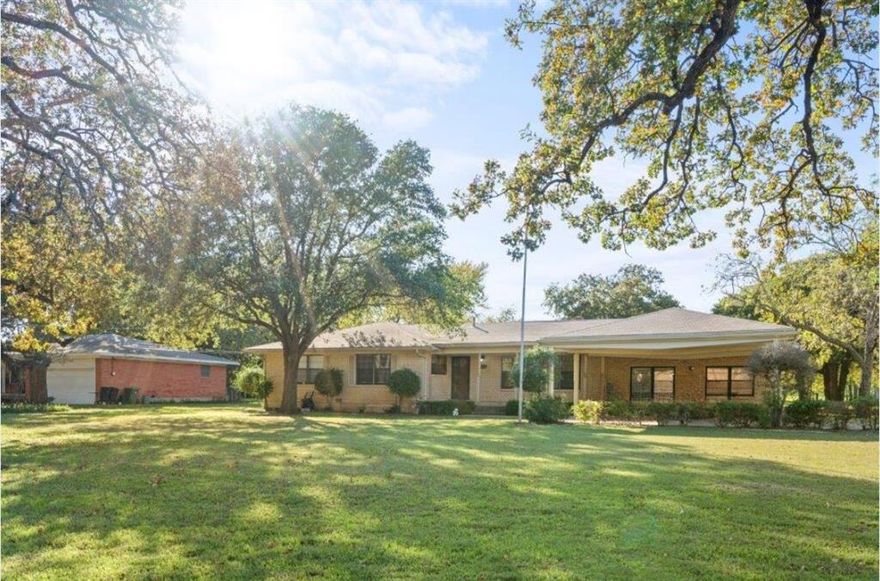 Incredible opportunity to own a one-story home on a beautiful ~.884 acre lot in a PRIME location that offers easy highway access for a short commute to DFW airport, Grapevine Lake, Fort Worth, Downtown Dallas, Southlake Town Square and much more! NO HOA! This flat lot with gorgeous trees creates a park like setting and provides the option to build your dream home, renovate the current house or create your own private oasis! There is plenty of parking options with the extended driveway that is perfect for RV or boat parking! Inside you are greeted with a very flexible floorplan. There is an extra living space that can be customized to suit your needs, whether it be a home office, entertainment room or another bedroom. The primary suite has his and her closets for added convenience and a bathroom that features tasteful upgrades, including granite countertops and a tiled shower. A RARE FIND!!