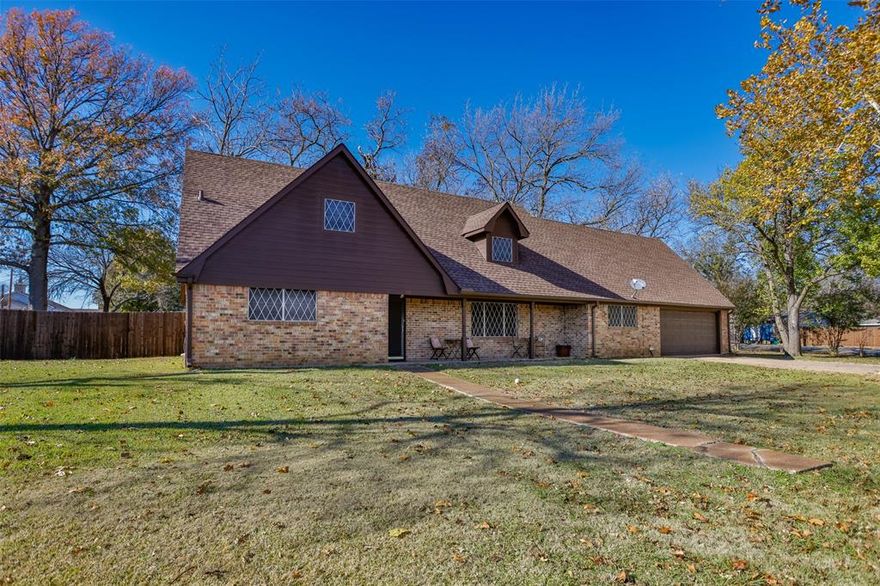 Discover a rare opportunity to own a a large lot and spacious home with this charming, family-owned brick home, offered for the first time in generations. Situated on a sprawling, nearly half-acre corner lot just minutes from the recreational paradise of Lake Texoma, this property offers unparalleled space, comfort, and potential. Only 15 minutes from shopping and restaurants in Sherman.  And also just a few minutes from Dr offices and hospitals.  This generous 2,850 sq. ft. home provides ample room for a large family, featuring 6 well-appointed bedrooms and flexible bonus room areas perfect for a home office, gym, or play space. The home offers a recently updated kitchen, sleek and resilient vinyl plank flooring throughout the main living areas, kitchen, and dining room. Key infrastructure updates ensure peace of mind, including a roof and gutters replaced just 3 years ago, a 1-year-old downstairs HVAC unit, and a brand a new water heater. The gorgeous lot is blanketed in lush St. Augustine grass and mature trees, offering a perfect setting for outdoor enjoyment.   A dedicated 240 sq. ft. workshop provides hobby space, complemented by an attached 240 sq. ft. covered porch for shaded relaxation.  Located mere minutes from Lake Texoma, the expansive lot provides abundant parking space for a boat or RV, making weekend getaways effortless.  A storm shelter is conveniently located in the backyard.  With abundant indoor and outdoor space, this property is a blank canvas awaiting your personal touch and creative vision. This beloved property blends the deep roots of family legacy with modern convenience and is ready to welcome its next chapter. Don't miss this unique opportunity

All information provided to be verified by Buyer and Buyer's agent.