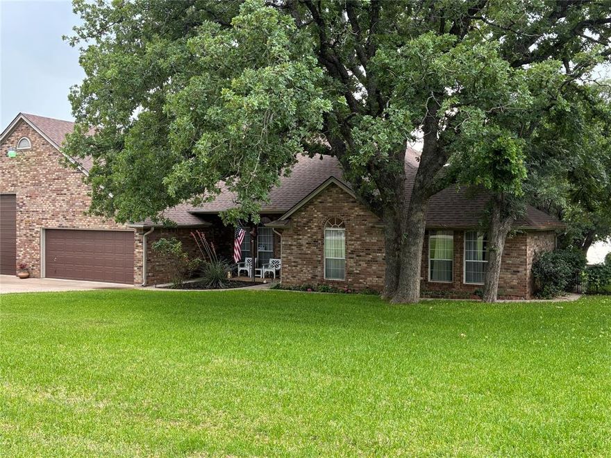 This is a RARE find. WATERFRONT PROPERTY on the coveted private road of Island Village Estates. This property has it ALL, including a dock with 12-foot water and irrigation system. Bedrooms are large and spacious. The large open dining area is currently used as a music parlor. Two HVAC systems. There is a 2-car garage, including a 220-volt outlet, plus a RV garage, plus storage, plus a heated and cooled Workshop...ALL under one roof. 533 square foot Workshop can be converted into a mother-in-law suite, or short-term rental with private entrance. It has a work sink and a separate toilet. HUGE Covered patio with epoxy flooring, large-fenced backyard that goes to the water, with many oak and pecan trees. Beautiful sunset view. New roof installed in 2025. When you do the math, that is a total of 2,935 square feet, that is both heated and cooled space. No HOA. Come and see!