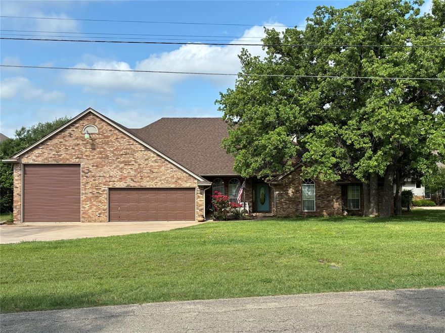 This is a RARE find. WATERFRONT PROPERTY on the coveted private road of Island Village Estates. This property has it ALL, including a dock with 12-foot water and irrigation system. Bedrooms are large and spacious. The large open dining area is currently used as a music parlor. Two HVAC systems. There is a 2-car garage, including a 220-volt outlet, plus a RV garage, plus storage, plus a heated and cooled Workshop...ALL under one roof. 533 square foot Workshop can be converted into a mother-in-law suite, or short-term rental with private entrance. It has a work sink and a separate toilet. HUGE Covered patio with epoxy flooring, large-fenced backyard that goes to the water, with many oak and pecan trees. Beautiful sunset view. New roof installed in 2025. When you do the math, that is a total of 2,935 square feet, that is both heated and cooled space. No HOA. Come and see!