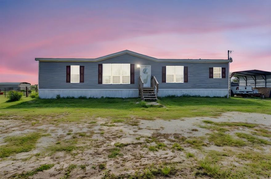 Discover the perfect blend of comfort and country living in this beautiful, nearly new doublewide home, situated on 4 unrestricted acres just outside city limits. With handicap accessibility, this home offers convenience and ease of living for all. Enjoy the peace and quiet of rural life while still being close to town amenities and within close to an hour of major cities with shopping and medical facilities.Step inside to a modern, well-maintained interior with spacious living areas, a bright kitchen, and comfortable bedrooms. The open floor plan creates a warm and inviting atmosphere, perfect for families or those seeking a peaceful retreat. Outdoors, you’ll find mature pear trees that provide delicious seasonal fruit, along with ample space for gardening, recreation, or livestock. This property is ideal for animal lovers or those looking to start a small homestead, thanks to the 18 x 20 barn and 18 x 10 greenhouse, which offer plenty of storage for feed, equipment, and plant cultivation. A sturdy 8 x 12 storage building ensures extra space for tools and outdoor gear, while the 18 x 20 carport keeps your vehicles protected from the elements. With no restrictions, you have the freedom to customize the property to suit your lifestyle, whether that means raising animals, starting a hobby farm, or simply enjoying the wide-open space.  This is an incredible opportunity to own a slice of the countryside with endless possibilities. Buyer to verify all information. Buyer will be responsible for survey. Don’t miss your chance to experience the beauty and tranquility of this wonderful property—schedule your showing today!