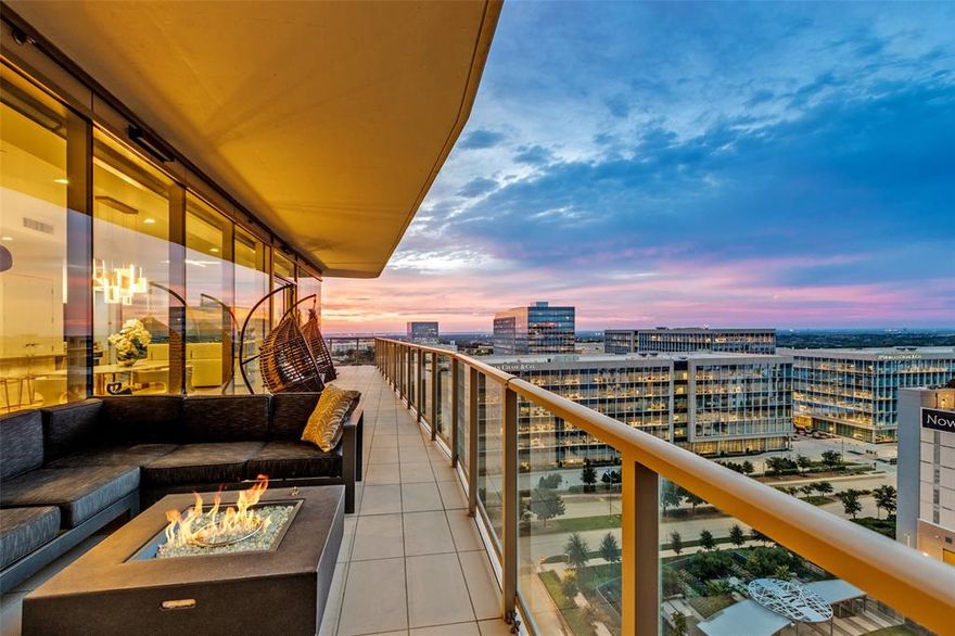 Premier North-West corner unit on the 11th floor of Windrose Tower—offering panoramic sunset views, a wrap-around balcony with fireplace and true lock-and-leave luxury in the heart of Legacy West. This exceptional home features 2 bedrooms, 2.1 baths and a versatile den or office with floor-to-ceiling glass that fills the space with natural light and city vistas. The wrap-around terrace with fireplace creates a seamless indoor-outdoor living experience—ideal for entertaining or quiet evenings above the city. Inside wide-plank wood floors, refined architectural details and electronic shades deliver a warm, modern aesthetic throughout. The chef’s kitchen is both striking and functional showcasing quartz countertops, an oversized island, Sub-Zero refrigerator, Wolf 5-burner gas cooktop and a dramatic floor-to-ceiling glass wine case—perfect for hosting or everyday luxury living. The primary suite is a serene retreat with a custom-designed walk-in closet, elegant textured accent wall and a spa-inspired marble bath. The secondary bedroom provides flexibility with a built-in Murphy bed and custom closet, ideal for guests or additional living needs. A climate-controlled private storage unit is included, offering added convenience rarely available in high-rise living. Windrose Tower delivers unmatched service and amenities including 24-hour concierge, valet parking 7-days a week and 2 assigned parking spaces in a secure, enclosed garage. Residents enjoy resort-style living with a saltwater pool, private cabanas, state-of-the-art fitness-wellness center, golf simulator, wine lounge, conference rooms, outdoor kitchens, landscaped terraces, pet spa and 2 reservable guest suites. Positioned near the corporate headquarters of Toyota, Liberty Mutual and Chase and minutes from premier shopping, dining and entertainment this residence offers a rare opportunity to own a refined corner unit in one of Plano’s most prestigious addresses—where luxury, privacy and lifestyle converge.