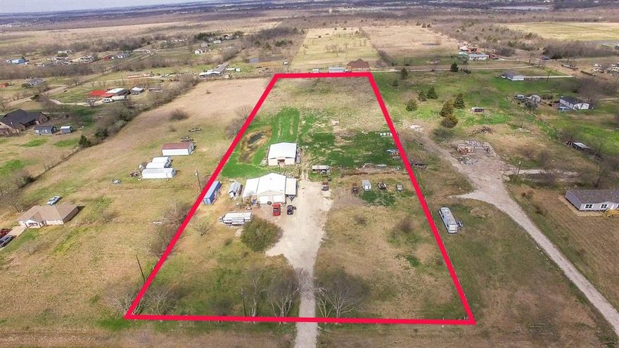 Discover the perfect blend of functionality and country living on this 5-acre property in Kaufman. Whether you're looking for a place to build your dream home, create a weekend retreat, or set up a small ranch or hobby farm, this property offers outstanding infrastructure already in place.

The centerpiece of the property is a 30’ x 40’ insulated metal workshop built on a heavy 8-inch concrete slab, featuring two roll-up doors and 220 electric service, making it ideal for equipment, business use, or serious hobbyists. A portion of the shop has already been finished out as an office with a mini-split HVAC system, and the structure could easily be converted into temporary or permanent living quarters while you build your home.

Additional improvements include a 12’ x 40’ attached awning perfect for covered parking, equipment storage, or outdoor workspace, along with a 12’ x 20’ enclosed storage area to keep tools and supplies organized.

The property is already equipped for immediate use with an existing RV hookup and septic system, plus two electric meters, providing flexibility for temporary living, guests, or recreational use.

Designed with livestock and country living in mind, the land is fenced and cross-fenced and includes a stock tank that can be used for livestock and fishing. Equestrian and animal enthusiasts will appreciate the barn with four stalls and a tack room, offering everything needed for horses or other animals.

With usable acreage, valuable improvements, and room to grow, this property presents a rare opportunity to enjoy peaceful rural living just minutes from town while having the infrastructure already in place to bring your vision to life.