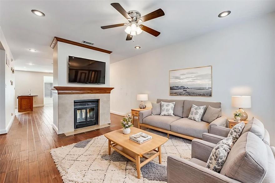 Blending style, comfort, and an unbeatable location near Baylor University Medical Center and the buzz of Lower Greenville’s dining, shopping and nightlife. This move-in-ready townhome features fresh paint and NEW carpet, delivering exceptional Dallas living at an outstanding price point. Just one block from the coveted Spanish World School, it offers both urban convenience and everyday ease.

Step inside to a welcoming living space anchored by a striking see-through fireplace, creating a seamless connection between the main living area and the kitchen, dining, and secondary living space beyond, perfect for entertaining and daily life.

A wood and wrought-iron staircase leads upstairs to the owner’s suite with ensuite bath, dual sinks, garden tub, separate shower, and a private outdoor balcony. An additional bedroom with its own full bath provides flexibility for family, guests, or a home office.

Out back, enjoy a covered patio overlooking a private, turfed outdoor space ideal for grilling, relaxing, or letting your pup play. A two-car garage with gated alley access adds privacy and convenience, completing this thoughtfully designed townhome in the heart of Dallas.