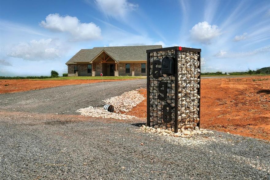 This new construction home sits on 13+ acres in Wylie West School District. This custom-built home delivers attention to detail, functional design, and great views. Located at the end of a quiet country cul-de-sac off the freshly paved County Road 321. Custom designed mailbox marks the entrance to the over-sized private driveway offering additional parking and functionality to add a detached shop. The vaulted front patio and 8 Ft double doors create a spacious and inviting entry. Open floor plan with neutral tones and abundant natural light. Gourmet kitchen with custom cabinetry with under lighting, granite counters, island, stainless steel appliances, undermount chef sink, and walk in pantry. Split-bedroom floorplan. West hallway leads to laundry room, mud bench area, guest bathroom, and the garage. Adjacent hallway leads to the primary suite with luxury vinyl floors and baseboard lighting. En-suite includes dual vanities, an oversized tiled shower with designer accents, and 2 walk-in closets. Spacious laundry room with additional hanging space, bar, and laundry chute door to primary bedroom. Additional bedrooms offer ample closet space and plush carpeting. Secondary bathroom with built-in storage, granite counters and a clean, bright design. Over-sized over 600 Sqft. garage with additional storage space. Sprinkler system. Rocked flowerbed and rain gutters to ensure ideal drainage. Ample exterior lighting. Fenced perimeter. Quiet and private while only minutes from Abilene. This home is fully move in ready, the builder planned for every detail. Southwest on Us-277, left on County Road 321, Home is at the end of the cul-de-sac.