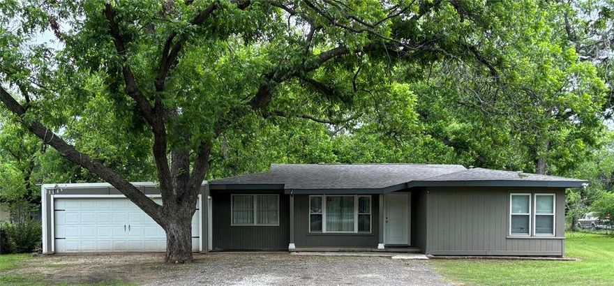 Bring the Boat, RV, and ATV! Beautifully updated home on .755 acres that includes granite counters, wood floors and efficiency storm windows. MASSIVE 40x40 SHOP with electric plus 40x20 covered awning in the county that can even be used commercially. Additional 827 sf garage plus bonus storage building with dog kennel or chicken coup. Large fenced yard with mature Pecan trees. Space to add a large vegetable garden. Short 3 min drive to community boat ramp on Eagle Mountain Lake. Country living, yet only 6 miles to Walmart Supercenter, 15 mins to Alliance Town Center.  Acclaimed Northwest ISD.
