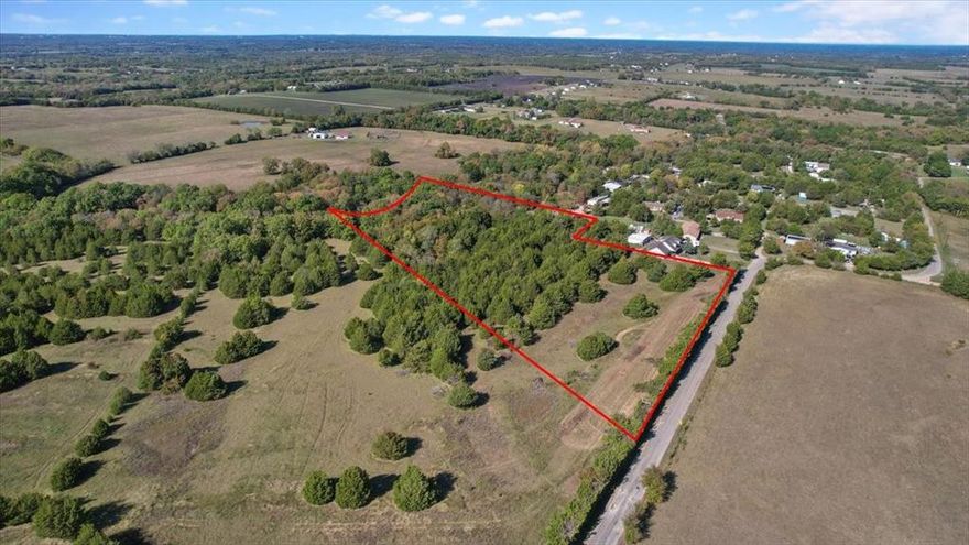 Are you looking for a piece of property outside of the city limits? This is a must see beautiful 10.1 Acre Tract to be surveyed out of a larger parcel.
Portions of this property is heavily treed with some rolling terrain. This is a great opportunity to purchase land to build a home or move a home on! Perfect place to raise kids, plenty of room for kids or animals to run or just enjoy the quiet country. No restrictions, No HOA.
Electricity along roadside. Buyer or buyer's agent to verify utilities.