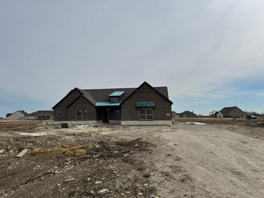 Estimated April 2026 completion! Ask us about our Trade In Trade Up program, we can buy your home! This sprawling single-story sanctuary spans 3,104 square feet and offers 4 bedrooms and 3 bathrooms, perfectly curated for a life of luxury and comfort. As you enter through the charming covered porch, the foyer beckons you inside, setting the stage for the grandeur that lies within. On one side, a versatile flex room stands ready to evolve into your personalized haven, whether it be a home office, gym or creative space. On the opposite side, an oversized bedroom and bath. Continue through to the heart of the home, where the main living area unfolds—a vast family room with a cozy fireplace, an inviting nook and a chef-inspired kitchen boasting an elongated island, ideal for culinary adventures and entertaining. On one side of the home, discover the secluded owner's suite, offering unparalleled privacy and tranquility. Enjoy the luxury of a spacious walk-in closet and a serene bathroom, creating an oasis of relaxation. On the opposite side, two traditional bedrooms await, each complete with its own walk-in closet, accompanied by a shared bathroom—perfect for siblings or guests. Functionality reigns supreme with the laundry and mudroom conveniently situated just off the 3 car garage entrance. Finally, step outside to the expansive covered patio, seamlessly blending indoor and outdoor living and promising endless opportunities for relaxation and recreation. In the Mockingbird layout, luxury meets functionality, offering an unparalleled living experience for homeowners in DFW.