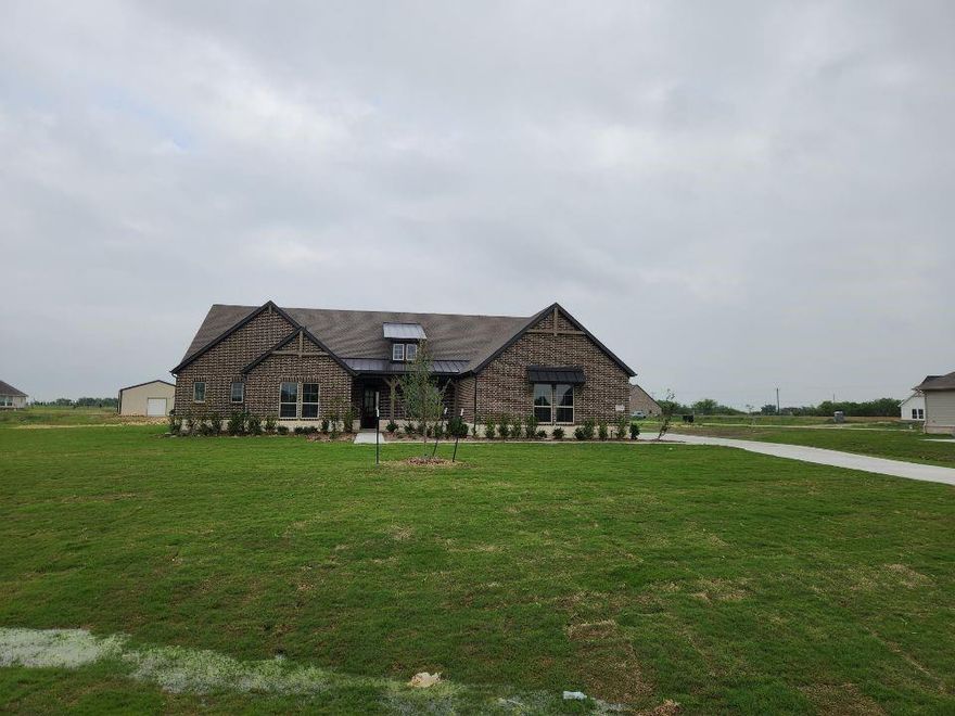 Estimated April 2026 completion! Ask us about our Trade In Trade Up program, we can buy your home! This sprawling single-story sanctuary spans 3,104 square feet and offers 4 bedrooms and 3 bathrooms, perfectly curated for a life of luxury and comfort. As you enter through the charming covered porch, the foyer beckons you inside, setting the stage for the grandeur that lies within. On one side, a versatile flex room stands ready to evolve into your personalized haven, whether it be a home office, gym or creative space. On the opposite side, an oversized bedroom and bath. Continue through to the heart of the home, where the main living area unfolds—a vast family room with a cozy fireplace, an inviting nook and a chef-inspired kitchen boasting an elongated island, ideal for culinary adventures and entertaining. On one side of the home, discover the secluded owner's suite, offering unparalleled privacy and tranquility. Enjoy the luxury of a spacious walk-in closet and a serene bathroom, creating an oasis of relaxation. On the opposite side, two traditional bedrooms await, each complete with its own walk-in closet, accompanied by a shared bathroom—perfect for siblings or guests. Functionality reigns supreme with the laundry and mudroom conveniently situated just off the 3 car garage entrance. Finally, step outside to the expansive covered patio, seamlessly blending indoor and outdoor living and promising endless opportunities for relaxation and recreation. In the Mockingbird layout, luxury meets functionality, offering an unparalleled living experience for homeowners in DFW.