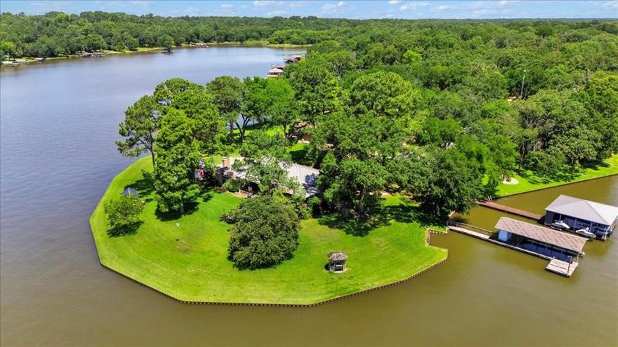 OWN THE POINT! Enjoy the breathtaking views of the open water on Cedar Creek Lake. The back patio has the perfect setting to unwind or entertain. The views make this location a PARADISE. 345 feet of open water frontage. Metal retaining wall. Boat dock, Hot house.Storage shed. 3 bedroom, 2 bath, 2 living areas, and a beautiful 16 x 38 Patio. The home does need updating, allowing you the opportunity to personalize it. DON'T MISS A CHANCE TO OWN YOUR OWN POINT ON CEDAR CREEK LAKE!