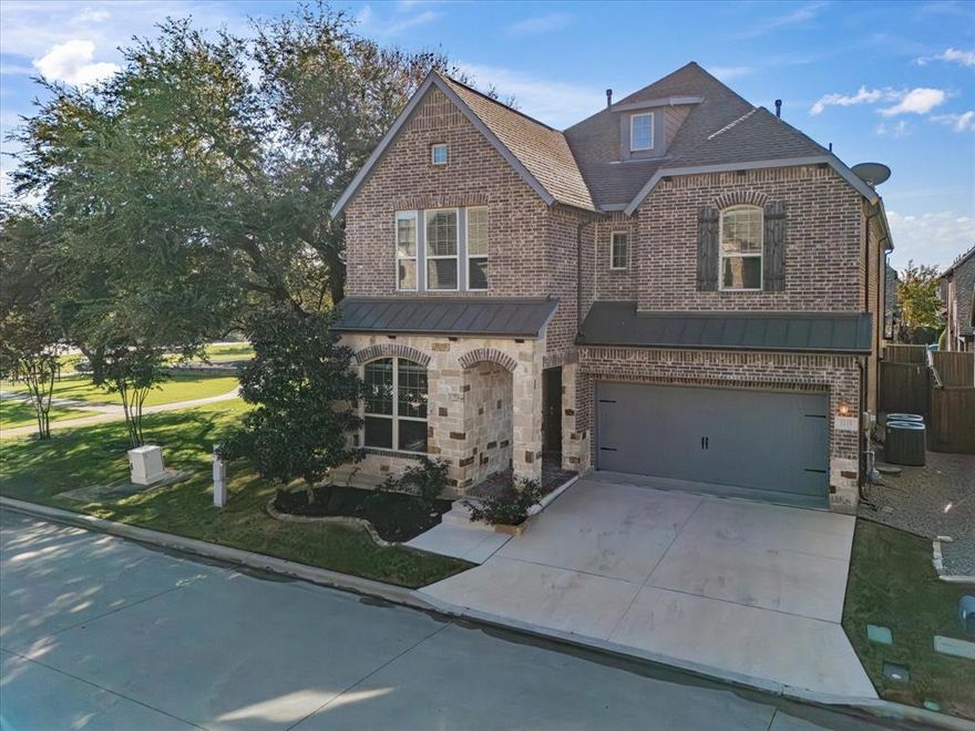 Tucked inside the exclusive gated community of Savoy Landing, this home offers luxury, functionality, and a highly desirable location. This immaculately cared-for David Weekley home sits on a unique lot bordered by a beautifully wooded park, providing a sense of space and privacy that's hard to come by. The main level showcases a light-filled open layout with soaring ceilings, a gas fireplace, and expansive windows that bring the outdoors in. The chef’s kitchen is a true showpiece, outfitted with an oversized granite island, Corian surfaces, custom cabinetry, and a built-in appliance nook—designed to handle everything from casual meals to entertaining with ease. A main-floor guest suite with a full bath offers flexible living arrangements ideal for overnight visitors or multi-generational households. One of the standout features of this home is a private, low-maintenance elevator that leads to the upper level. Upstairs, you’ll find a sprawling 20x20 primary suite complete with a sitting area, built-ins, a spa-like ensuite with dual vanities and a glass-enclosed shower, and an expansive walk-in closet customized with thoughtful storage solutions. Two additional bedrooms share a full bathroom, while the upstairs laundry room adds everyday convenience. Elegant touches such as marble tile flooring, carpet in bedrooms, designer lighting, ceiling fans, an owner-owned security system, and an on-demand tankless water heater elevate the home’s comfort and efficiency. Outside, enjoy the bricked patio that backs directly to the park, with wrought iron fencing and a private gate providing direct access to serene green space. Recent upgrades include a new concrete driveway, walkways, retaining wall, and a secure side gate, adding even more value to this low-maintenance property. The oversized three-car tandem garage ensures plenty of storage and workspace. With HOA-covered front yard care, this home is perfect for those seeking a lock-and-leave lifestyle.