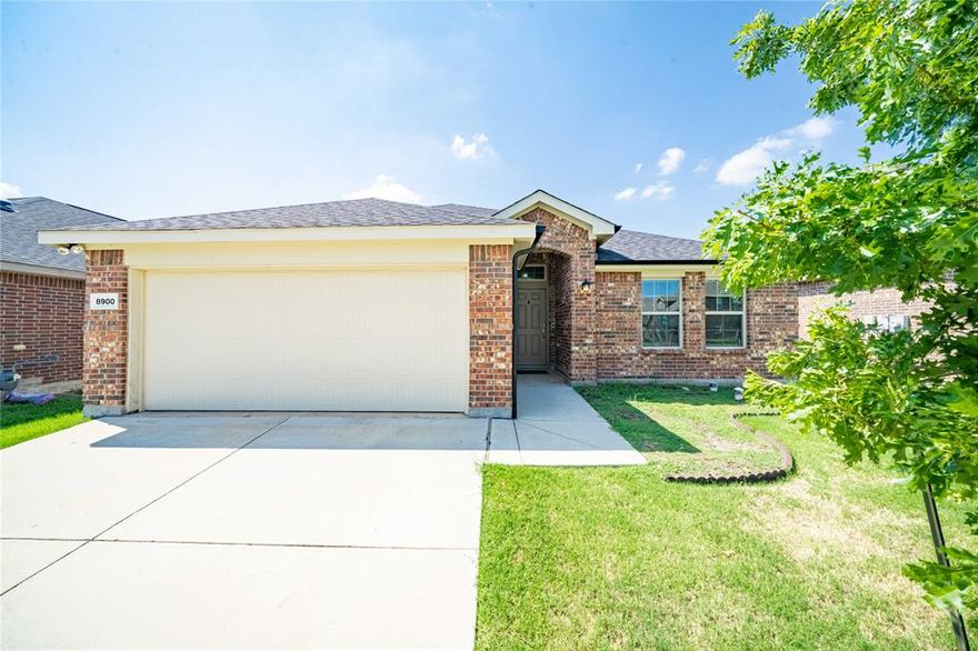 Beautifully maintained and move-in ready, this like-new 3-bedroom, 2-bath home offers a spacious open-concept layout designed for comfortable everyday living and entertaining. The gourmet eat-in kitchen features granite countertops, a large center island, stainless steel appliances, a gas range, and ample cabinet space. The inviting living room is highlighted by a cozy gas-log fireplace, creating the perfect gathering space. The oversized primary suite provides plenty of room for a sitting area and includes a luxurious ensuite bath with dual vanities, a soaking tub, separate shower, and a large walk-in closet. Additional features include Amazon smart home wiring and a water softener. Step outside to enjoy the covered back patio and spacious backyard. Residents also enjoy access to community amenities including a pool and playground. Conveniently located near shopping, dining, and major highways, this home combines modern comfort with exceptional value.