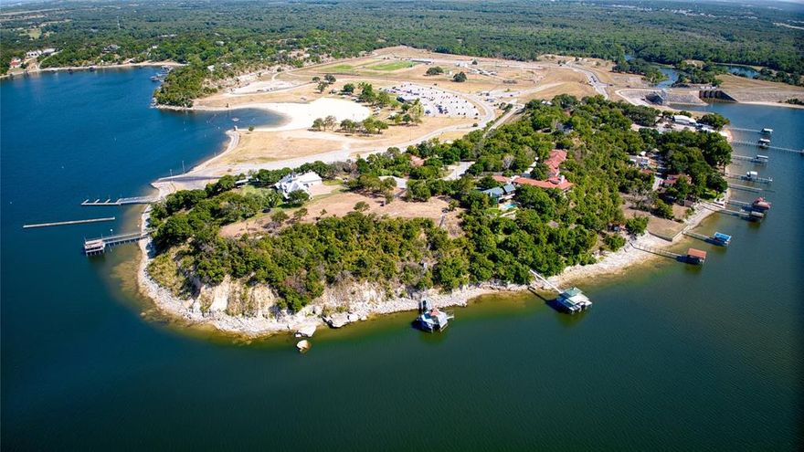 RECENTLY REPLATTED INTO ONE LOT. WILLING TO DIVIDE INTO TWO LOTS 1.8M EACH. This property sits atop one of the highest points of the lake offering breathtaking 300-degree views that stretch for miles, granting you an unparalleled experience like no other. Not only is this property at one of the highest points but it is also at one of the deepest parts of the lake, in close proximity to the dam. Whether you're seeking the thrill of reeling in the day's catch or yearning for exhilarating adventures on the water, Lake Eagle Mountain is an aquatic playground! On one side the property has a double-decker dock where you can relax and immerse yourself in the tranquil ambiance. Don't miss out on this remarkable waterfront property!