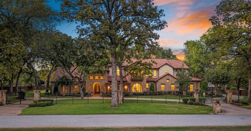 Tucked away on a quiet cul-de-sac, this stunning Stewart Custom Home sits gracefully on a full acre surrounded by breathtaking mature trees, offering privacy and serenity in the heart of Colleyville. The first floor showcases 3 spacious bedrooms, including a secondary suite that lives like a second master along with a private office and a dedicated media room. The gourmet kitchen is the heart of the home, featuring Wolf and Sub-Zero appliances, a large island and seamless flow into the family room with its warm exposed beams, perfect for everyday living and effortless entertaining. Upstairs, 2 ensuite bedrooms are complemented by a generous game room and a dedicated exercise room, ideal for family living and guests alike. Step outside to your private backyard retreat: an oversized lawn, covered patio with grilling station, raised spa and sparkling pool, all set against the lush backdrop of a private irrigation well. A covered living space with fireplace and a seamless glass view into the great room creates the perfect setting for year-round entertainingThe property also includes a spacious four-car garage with custom cabinetry, providing incredible storage and function.