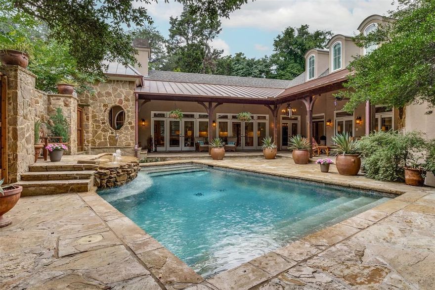 This French country residence graces a premier block of Kessler Park. With over 5,000 square feet of pristine interior space, it boasts clean lines and exceptional craftsmanship. The living room, owner retreat, kitchen, and family room exude warmth with fireplaces and overlook the spectacular courtyard. A culinary masterpiece awaits in the chef's kitchen, with top-of-the-line appliances seamlessly connecting to the living room and breakfast area. The large primary suite boasts a sitting area, an indulgent bath retreat with dual vanities & a light-filled shower, and a soaking tub. 4 additional bedrooms, a Spacious office, and a spectacular home theater room set this home apart from all others. Other features include a recently installed roof, which includes an extensive copper portion, a saline pool and spa, a 3-car garage, four fireplaces, Wood flooring, designer lighting, raised ceiling heights, and Kessler's finest location. An exceptional home for entertaining and gracious living.