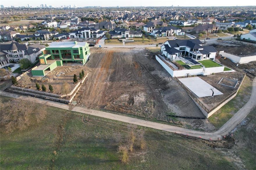 THIS LOT IS NOT TIED TO ANY BUILDER-PICK YOUR OWN APPROVED BUILDER. Don't miss the rare opportunity to own a premium 1.20-acre lot on the most sought-after Lilac Lane, located in Frisco’s most prestigious neighborhood Hills of Kingswood. This exceptional property backs to hundreds of acres of pristine, wooded preserve—offering privacy, serenity, and unbeatable natural views. Enjoy direct access to the scenic neighborhood trail, perfect for jogging, biking, dog walks, or peaceful evening strolls. The unique topography of this lot allows for incredible architectural possibilities, including the rare chance to build a Texas walk-out basement opening to your own backyard oasis—ideal for pools, gardens, and more. With ample space, there's room for a full-size basketball court and even a Red Zone football field. Relax on your veranda and watch deer and other wildlife as you take in breathtaking sunsets and tranquil surroundings.