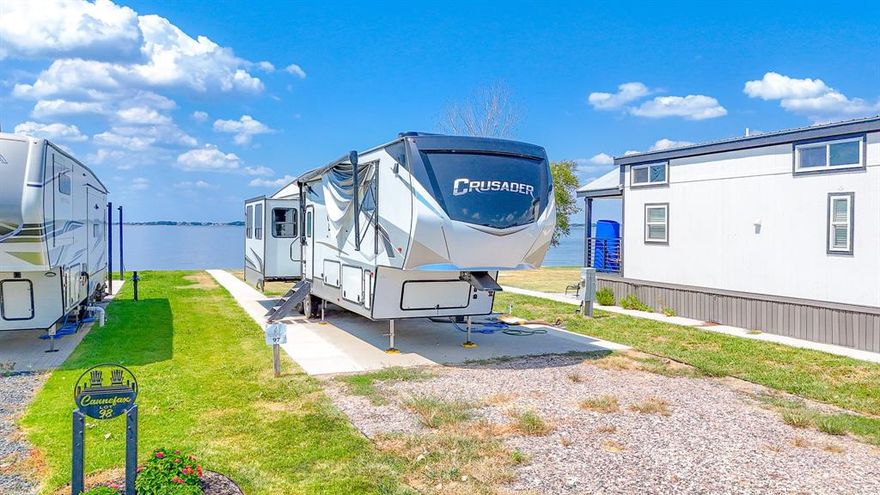Premimum Lot 97 located in Peninsula Point on the shores of Richland Chambers Lake. If fishing is your thing, this could be your spot.  Excellent location for fishing or relaxing. Waking up to sunrises over the water, getting out on the water for fishing & boating all day, & then coming back for a recharge as you sit by the waters edge under the pergola watching the amazing sunsets! The water tap fee is already paid to keep some extra money in your pocket too! Lot has expanded concert pad and sidewalk to the water as well as a pergola. Peninsula Point features great community amenities like a sparkling pool for hot summer days, an open air clubhouse, laundry facility, boat storage, boat ramp & even more! This lot features a steel retaining wall for an easy tie up for your boat. The lake is great for fishing, boating, jet skis and more. Just 65 minutes from Dallas. This community is short term rental friendly, so you can rent out your new purchase for an income stream! See the uploaded documents for more info.