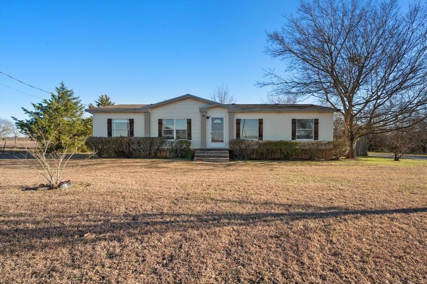 Welcome home! This roomy, clean, close to town, well maintained, excellent condition double wide on almost an acre of land awaits you. It feels brand new because it was cared for through out its life.
4 bedrooms, 2 full baths, laundry room, carport, covered patio. The kitchen has an island and ample cabinets and a pantry for storage. The primary bathroom has large walk in closet, garden tub, double sinks and separate shower. Dining area has sliding glass doors out to a small covered-deck area and a patio. Laundry room has door with access to carport. Large backyard supplies plenty of room for pets, chickens, gardening and small 4H projects.

All measurements are accurate but not guaranteed, buyer should verify all measurements.