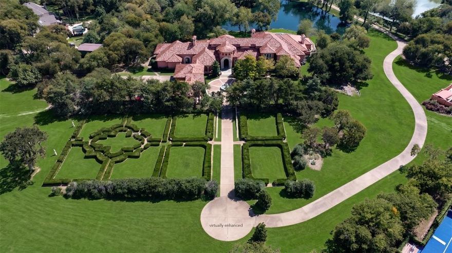 Escape to a world where the golden age of Palm Beach architecture meets modern-day opulence. This hidden 12.8-acre Mediterranean sanctuary, inspired by the legendary Addison Mizner, is a 12,872 sq ft testament to a life of curated elegance. A winding, tree-lined private drive welcomes you into a lifestyle defined by artisanal heritage and luxury. The home’s aesthetic reflects a symphony of rare materials: limestone columns, hand-carved mahogany doors, and masterful Cassi Plaster ceilings. In the formal living room, Bordeaux wood floors glow under the light of a spectacular chandelier, while an arched window offers a cinematic view of the private one-acre pond. The great room creates the ultimate stage for the host, featuring cypress-beamed ceilings and a magnificent Parisian chandelier. Evening parties are hosted around the wet bar, complete with a wine room and built-in draft. A seamless transition of the expansive limestone veranda continues outside, featuring a stunning hand-painted mural that says “The Good Life” in Latin. Culinary pursuits await in the gourmet kitchen, where London-inspired frescoes and cast-stone surround a suite of Sub-Zero, Viking, & Gaggenau appliances. A butler’s pantry, featuring a lined silver closet, ensures every gala executes with precision. The primary wing is an enclave of indulgence, where hand-painted ceilings and a fireplace lead to his & hers retreats adorned with beautiful marble floors. For the fashion connoisseur, two expansive walk-in closets and a two-story walk-in cedar closet provide a gallery-like space for any collection. Conveniently located in the next room is your home gym. Outside, the estate feels like a private European resort. Spend afternoons by the lap pool and spa, entertain with the wet bar, or wander through lush gardens to the greenhouse. For the automotive collector, a finished 20-car garage complex with lifts and a full living quarters awaits. A full-size guest house also resides on the grounds.