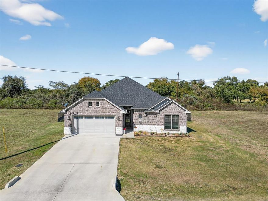 ACKER BRADBURY home awaits you in the highly coveted White Bluff Resort at Lake Whitney. Immerse yourself in sheer beauty and be captivated by the exquisite layout and features of this 3 Bedroom, 2 Bath Home. Walk into a beautiful entry way, leading to a very spacious living area with a wall of windows, offering ample natural light. The kitchen offers plenty of cabinets for storage, a propane gas range and a large island with seating and space for serving; great for entertaining or large family gatherings. Outside you will find a great space for outdoor living, large concrete pad (20x32) that is fenced to keep pets separated. Landscaping and fully sodded with irrigation. Nestled within a secure gated community, White Bluff Resort boasts the breathtaking Lake Whitney, known as one of Texas' most picturesque lakes. Indulge in the resorts exceptional amenities, including two 18 hole golf courses, four swimming pools, enticing restaurant, tennis courts, playgrounds, parks, marina, volunteer fire department, conference center and even a hotel.