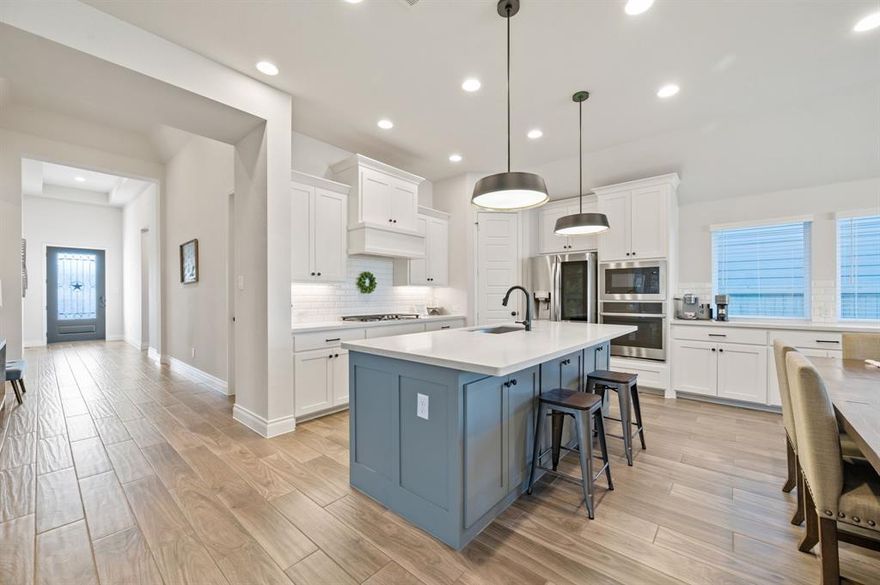 This beautifully maintained 4-bed, 3-bath home offers both comfort and convenience in one of the most desirable communities in the area. An extended entry leads into the open kitchen, dining area, and family room. The kitchen offers a corner walk-in pantry, abundant counter space, and a large island. The dining area flows seamlessly into the family room, creating an ideal layout for everyday living and entertaining. The oversized primary suite features a spacious bathroom with dual vanities, a large jetted tub, a separate shower, and two generous walk-in closets. Living in Pecan Square includes access to high-speed internet, a fitness center, multiple pools, coworking spaces, playgrounds, a dog park, and a full calendar of community events. The location also provides convenient access to Alliance, Roanoke, Denton, and Southlake.