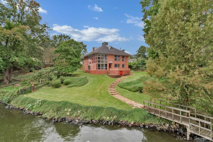 ***SELLER offering $10,000 allowance for boat dock repairs*** Step inside this lakefront home with breathtaking views. This three bedroom, three bath home has expansive ceiling height with panoramic windows that beautifully show off Cross Lake. The updated kitchen has a six burner gas cooktop, convection oven and the views continue while cooking. All bedrooms are located on the second floor with a loft style that provides so much natural light coming in from the floor to ceiling windows coming from the main living space. A full bathroom located on the first floor near the garage is convenient for guest. The laundry room has a sink, full refrigerator and full washer and dryer. Whether you're wanting a full time lake retreat or a weekend escape, this lakefront beauty is one to see!