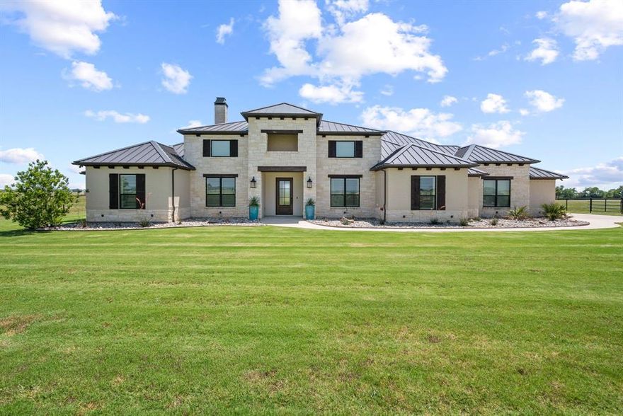 COOLEST EQUINE NEIGHBORHOOD IN ALL OF TARRANT COUNTY. Ride your horses along the extensive horse trails in your own backyard. Amazing custom built home! Beautifully designed open concept. No cost spared to make the home flow, work, look & feel magnificent. Massive kitchen with oversized granite island & commercial grade appliances. Exceptional for entertainment. Separate walk-through bar with specialty refrigerator & ice maker. INCREDIBLE MASTER BEDROOM SUITE! Huge ensuite bathroom with oversized shower & deep soaker tub. Wake up to the smell of fresh brewed coffee with a convenient coffee bay right in the bathroom. And then there is a fabulous MASTER CLOSET with a vanity station with a sink inside closet. Just get ready and close the door. Closet also has a direct access to the utility. JUST INCREDIBLE. Gets better ! Home boasts of a Safe Room & Indoor storm shelter. Oversized 3-car garage w-epoxy floor. Massive covered outdoor living space. Sparkling modern pool with all pool equipment, outdoor lights, property gate, garage + more all having control access via remote and-or phone app. Almost 20 acres of open pasture, native grass & 4-stall barn. Let's not forget the 4-hole putting green. Its an amazing place to live and entertain.  Community offers 7+ miles of equestrian trails around Benbrook lake & appx 100 acres of common area. Away from the city but centrally located. >15 mi to downtown FTW, & 30 mi. to Granbury & Weatherford. between Hwy 377 & Chisholm Trail Pkwy. Buyer & Buyer Agent to verify all information herein.