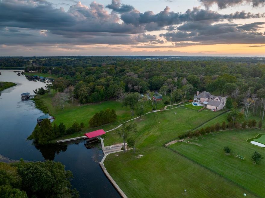 Welcome to 2001 Rose Pointe on Lake Athens, where lakeside luxury meets the tranquility of the countryside. Situated on 2.7 acres in an exclusive gated community, this beautiful home was recently renovated in 2022 for modern comfort and enjoyment. This expansive property includes a finished out 35x35 climate controlled workshop, complete with loft, that provides abundant space for projects, tools, or parking your recreational toys, an ideal setup for hobbyists or outdoor enthusiasts.

Step inside to a beautifully updated kitchen, dining, and living area, anchored by a cozy gas log fireplace. The home boasts two versatile secondary living spaces, a spacious office, and a primary suite with breathtaking lake views from a newly added covered balcony, perfect for morning coffee or evening sunsets.

The screened in porch with fireplace seamlessly connects to the backyard entertainment area with heated gunite saltwater pool and spa surrounded by travertine coping, cool deck and flagstone decking. After a day on the lake or lounging by the pool, relax under the cedar pergola, complete with a built-in grill and custom cabinetry, or gather around the firepit for starry nights. Additional backyard features include an engineered drainage system and stone walkway that leads down to the boathouse. The boathouse is equipped with two boat slips ready for your bass boat or pontoon. The dredged channel allows for easy access year round to the clean open waters of Lake Athens.

Other thoughtful upgrades to the property include an irrigated flower garden with perimeter stone wall, a lake pump irrigation system and home generator that provides peace of mind in any weather.

This exceptional property combines privacy and security with convenient access to local gems, including the East Texas Arboretum, Texas Freshwater Fisheries Center and the Athens Boathouse Bar and Grill, all just minutes away. Don't miss your opportunity to own this property! Call me today for a tour.