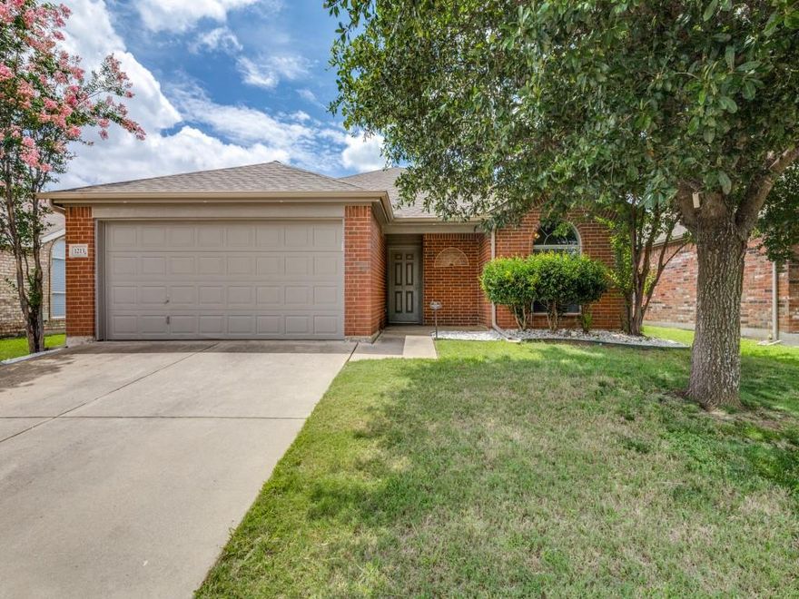 Welcome to this well-maintained 3-bedroom, 2-bath home nestled on a quiet cul-de-sac in the sought after master planned community of Sendera Ranch. This inviting one-story layout features durable laminate and tile flooring throughout—NO CARPET!  The kitchen is a standout with granite countertops, stainless steel appliances including an electric cooktop and built in microwave, a spacious island, and ample cabinet storage—perfect for both daily living and entertaining. The primary suite offers an ensuite bathroom with dual sinks, a separate shower, relaxing garden tub, and TWO walk-in closets. The thoughtful split-bedroom floor plan provides added privacy, with the secondary bedrooms—each featuring walk-in closets—separated from the spacious primary suite. Enjoy peaceful views with no rear neighbors as the home backs to a scenic greenbelt and walking trail. Additional highlights include a utility room with built-in shelving, a covered patio with fan for outdoor enjoyment, and INCLUDED WASHER, DRYER AND REFRIGERATOR—making this home truly move-in ready!  Residents of Sendera Ranch enjoy access to on-site elementary and middle schools, pools, playgrounds, basketball courts, soccer fields, baseball fields, hockey rink, clubhouse, gazebo, ponds, greenbelts and parks. The community also offers miles of walking trails, many leading to or circling the neighborhood lake and waterfall. Enjoy unmatched convenience just minutes away—7-Eleven is  nearby and Kroger Marketplace is set to open in 2026. Easy access to Texas Motor Speedway, Alliance Town Center, and major highways,  offering quick commutes and nearby shopping, dining, and entertainment. HVAC SYSTEM REPLACED IN 2022. NEW DISHWASHER, RANGE, MICROWAVE AND REFRIGERATOR IN 2022. WATER HEATER REPLACED in 2023. Make this home yours today!