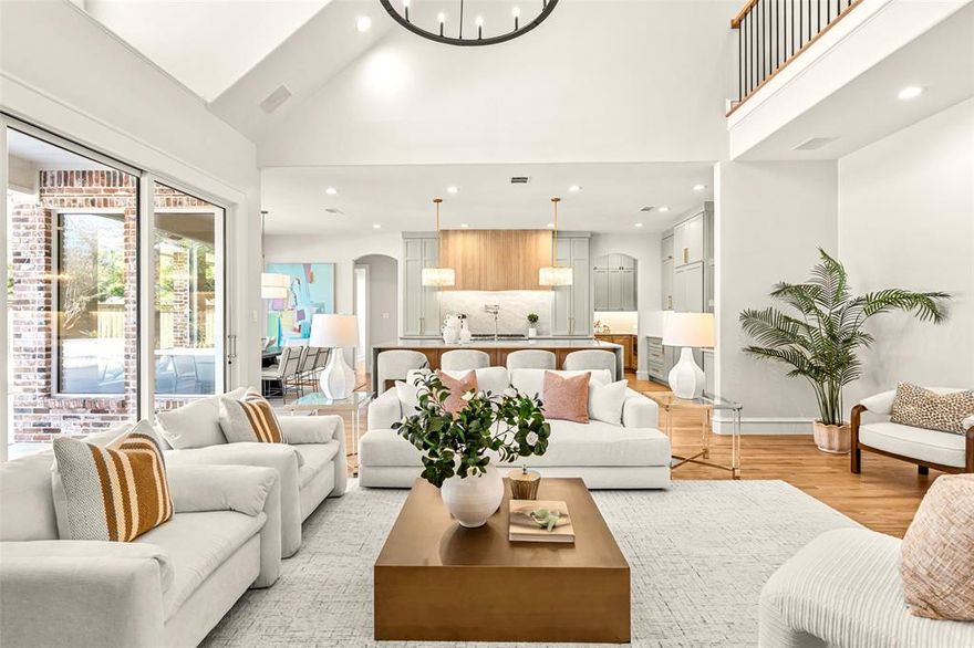 Experience unparalleled luxury and timeless design in this one of a kind remodeled six-bedroom executive home. Completely redesigned from the ground up, with every detail meticulously curated, this home offers the sophistication of a brand-new custom build in one of Southlake’s most established and sought after neighborhoods. Step inside to find refinished hardwoods flowing seamlessly throughout, complimented by museum finish smooth-coat walls and ceilings dripping with Visual Comfort lighting. The stunning new staircase adds an architectural focal point to the modern floor-plan while the graciously sized formal living and dining provide the elegance and grandeur an executive home demands. A private office with custom woodwork provides a refined work environment, while the bright open-concept living with 12’ sliders opening to the large patio invites year-round entertaining. The gorgeously designed chef’s kitchen will impress with 10’ Quartzite waterfall island, 48” Wolf range with statement fluted hood, designer backsplash, floor-to-ceiling cabinetry, panel-ready appliances and perfectly appointed back kitchen offering additional prep space, storage, and one of two walk-in pantries. The dry bar with beverage fridge and wine storage further elevates the culinary and hosting experience, with the nearby mud room and laundry blend functionality with style. Retreat to the primary suite, a haven featuring spa-like bath with white oak cabinetry, soaking tub, oversized shower and large walk-in closet. Guests enjoy their own private ensuite with designer bath. Upstairs, you'll find a huge game room, 4 bedrooms and a versatile flex space, ideal for a home gym, studio, or study. Outside, the large lush yard surrounds a fully remodeled sparkling pool, providing a serene retreat for relaxation or play. With too many upgrades to list and easy access to golf, shopping, parks and Carroll ISD, this home delivers an unmatched blend of exclusivity, convenience, and modern luxury.