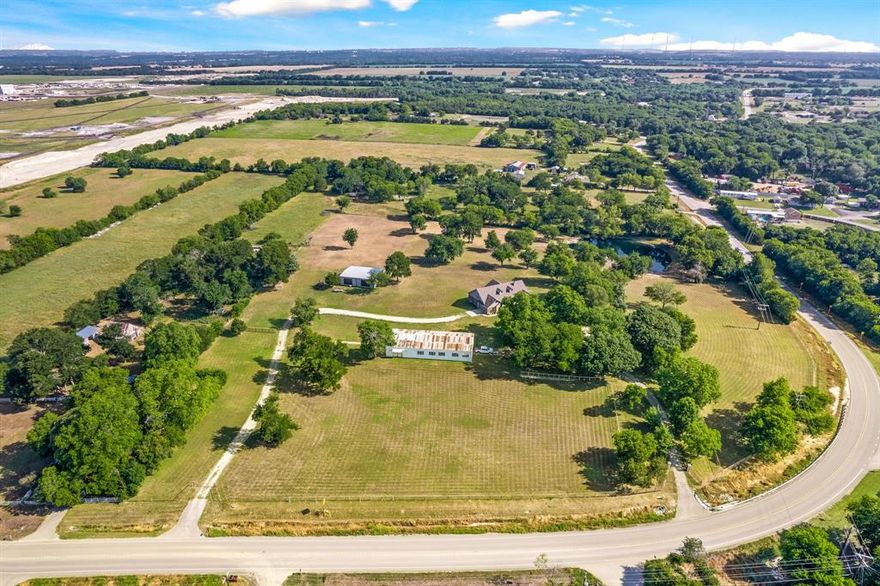 Welcome home to the perfect in town ranch. This gorgeous property on 10 picturesque acres features a beautiful custom home and amazing views! 2 barns and fully fenced and cross fenced. 3600 sqft barn and a 40 by 50 shop! Auto gates. Separate entrance for barn. Stocked pond. Gorgeous trees and prime location in McKinney. Ag Exempt. Horses welcome! Dual Zoned property with lots of possibilities! 10 minutes to Downtown McKinney and 10 minutes to the lake! Great location!