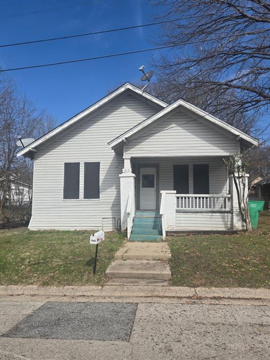 This 2 bedroom, 1 bathroom home sits on a spacious lot in a quiet Gainesville neighborhood.  Built in the 1930s, it offers solid bones and a traditional layout.  This property could easily be a resale, rental, or residential home. The covered front porch is south facing for warm evenings and cozy morning coffee.   The fenced in backyard is perfect for gatherings, as well as a play area for children and pets. Recent updates include flooring in the backroom, and plumbing updates in the bathroom.