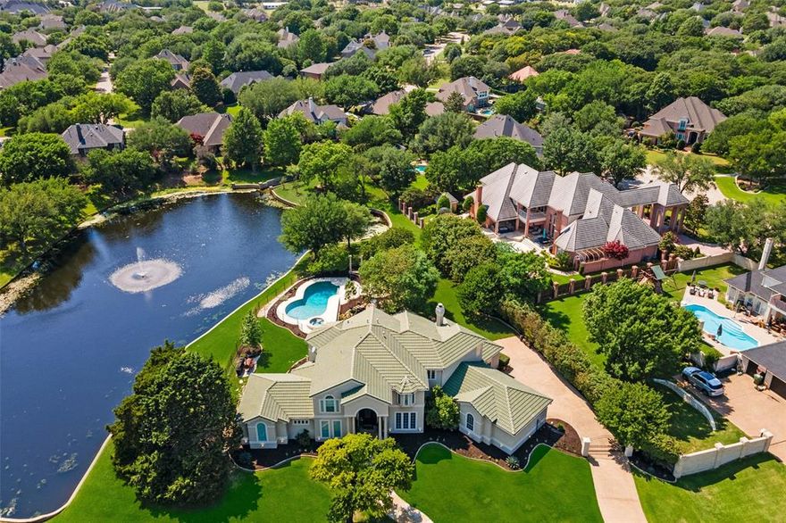 MAGNIFICENT WATERFRONT ESTATE IN HIGHLY SOUGHT AFTER COMMUNITY OF THE DOMINION! WALK TO ROCKENBAUGH ELEMENTARY, TIMARRON COUNTRY CLUB AND GOLF COURSE! THE PERFECT SOUTHLAKE LOCATION, CONVENIENT TO SHOPPING, ENTERTAINING, FINE DINING AND PROFESSIONAL SERVICES! THIS MODEL PERFECT HOME IS MOVE-IN READY, JUST BRING YOUR TOOTHBRUSH! WELL THOUGHT OUT FLOOR PLAN, OPEN ENTERTAINERS KITCHEN WITH BREAKFAST AREA,  LIGHT, BRIGHT AND SPACIOUS ROOMS AND STUNNING VIEWS OF YOUR OWN BACKYARD PARADISE! YOU WONT NEED TO TRAVEL TO THE RESORT, BECAUSE IN THIS HOME, THE RESORT CAME TO YOU! EXPERIENCE THE ULTIMATE IN THE SOUTHLAKE LIFESTYLE. DREAMS DO COME TRUE, BUT HURRY BEFORE THIS EXCEPTIONAL PROPERTY IS GONE! EXEMPLARY CARROLL I.S.D.