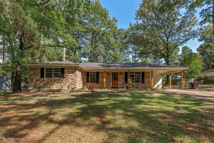 Welcome to this beautifully remodeled home in the sought-after Merry Woods subdivision of Haughton. Situated on a generous half acre lot surrounded by mature trees, this 4-bedroom, 1.5-bathroom residence offers the perfect balance of modern updates, timeless charm, and serene country living. With 1,436 square feet of thoughtfully designed space, every detail of this home has been refreshed to provide comfort, style, and peace of mind. Step inside and you’ll immediately notice the bright, open feel enhanced by fresh paint, new flooring, and abundant natural light streaming through large windows. The living area flows seamlessly into the dining and kitchen spaces, creating a warm, inviting atmosphere ideal for everyday living or entertaining. The kitchen has been fully updated with sleek cabinetry, quartz countertops, new stainless steel appliances, and a contemporary backsplash. Each of the four bedrooms is well-sized, offering flexibility for family, guests, or even a home office. The bathrooms have been completely updated as well. A brand NEW HVAC system and water heater ensure efficiency and reliability, giving buyers peace of mind for years to come. Outside, the large lot offers endless opportunities for outdoor enjoyment, gardening, or simply relaxing beneath the shade of towering trees. A separate workshop provides the perfect space for hobbies, storage, or projects, adding incredible functionality to the property. The extended driveway and carport provide ample parking, while the quiet street enhances the peaceful setting. This move-in ready home combines modern upgrades with the charm of a well-established neighborhood in a prime Haughton location. Don’t miss your chance to own a fully updated home with acreage and a workshop! Call to schedule your showing today and discover all that 128 Taylor Bend has to offer!