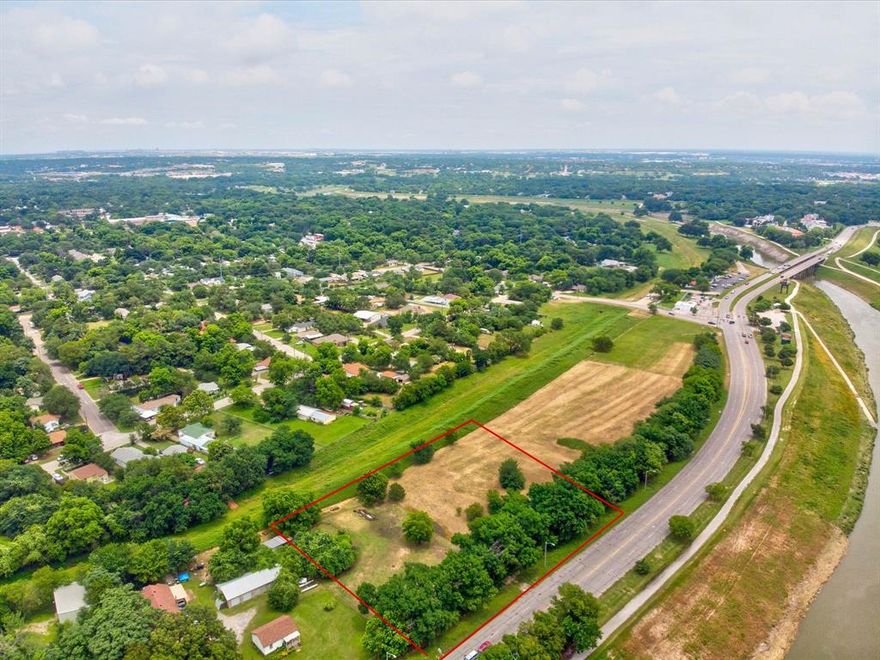 Over an acre commercial interior lot right on White Settlement Road with unobstructed view of the Trinity River. Situated between gated luxury neighborhood, restaurants, boutique office spaces, and a multitude of varying living options. This property offers a unique opportunity to be a part of the growing developing West Fort Worth River District. Near Crestwood, Monticello, eight minutes to downtown Fort Worth.  Fort Worth is one of the fastest-growing cities in the nation, supported by a robust economy, expanding infrastructure, and strong demographic trends. The local area features a stable population base, a growing workforce, and a supportive pro-business environment, further enhancing the site’s long-term investment appeal.
 C1. Future Zoning Designation Mixed Use. In Neighborhood Empowerment Zone.